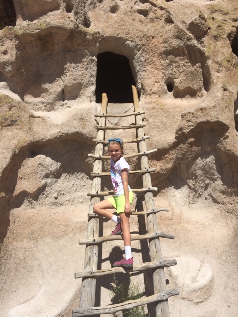Little Coyote (Zia's daughter) climbs up into a cavate.